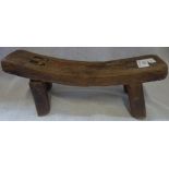 A CHINESE ELM PILLOW in the form of a bench, 35cm long