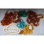 A COLLECTION OF "AMBER" BEAD NECKLACES, together with three other bead necklaces
