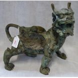 A LARGE PATINATED BRONZE DRAGON, the surface with stylized decoration, 28cm long