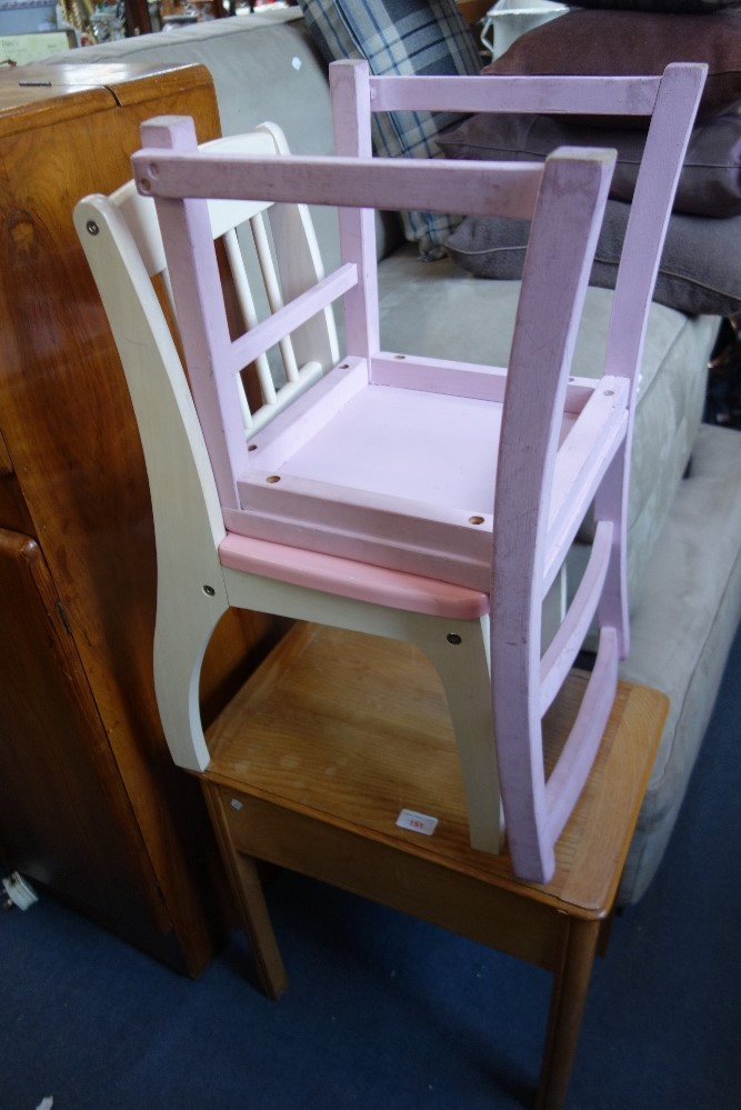 A CHILD'S ASH DESK with lift-up lid and two painted child's chairs