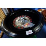 CHAD VALLEY; A VINTAGE BLACK BAKELITE ROULETTE WHEEL, 19cm dia and a green baize gaming mat with