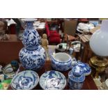 A BLUE AND WHITE TIN GLAZED COSTREL, four Chinese dishes, a stoppered jar and other items