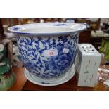 A CHINESE BLUE AND WHITE JARDINIERE AND SAUCER and a similar glazed brick