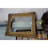 A 19TH CENTURY MOULDED GESSO AND GILT PICTURE FRAME, the aperture 37cm x 50cm (sight)