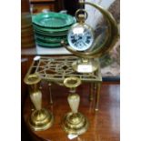 A GLASS GLOBE CASED WATCH with stand, two trivets and a pair of candlesticks