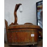 A WOODEN STAVED BUCKET decorated with a carved bird's head, 42cm dia.