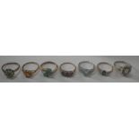 A COLLECTION OF DRESS RINGS, six marked 9k and one silver