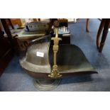 A COPPER AND BRASS COAL SCUTTLE with turned wooden handle and engraved armorial