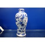 A CHINESE BLUE AND WHITE VASE decorated with birds and flowers, 19cm high