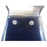 A PAIR OF DIAMOND SOLITAIRE EAR STUDS, claw-set in white gold, approx. 0.65ct total weight