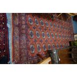 A RED GROUND PERSIAN RUG, 170cm x 233cm (plus fringes)