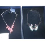SWAROVSKI: A COLLECTION OF COSTUME JEWELLERY, comprising five necklaces / pendants, in fitted