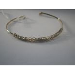 A 9CT YELLOW GOLD BRACELET, three panels set with micro diamonds, with heart shape links,