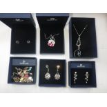 SWAROVSKI: A COLLECTION OF COSTUME JEWELLERY, comprising three necklaces / pendants, and three pairs