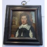 A MINIATURE OIL PORTRAIT OF A JAMES I GENTLEMAN, with a heraldic crest verso, 7.5cm high (within