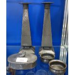 A PAIR OF ARTS & CRAFTS HAMMERED PEWTER CANDLESTICKS and similar pewter