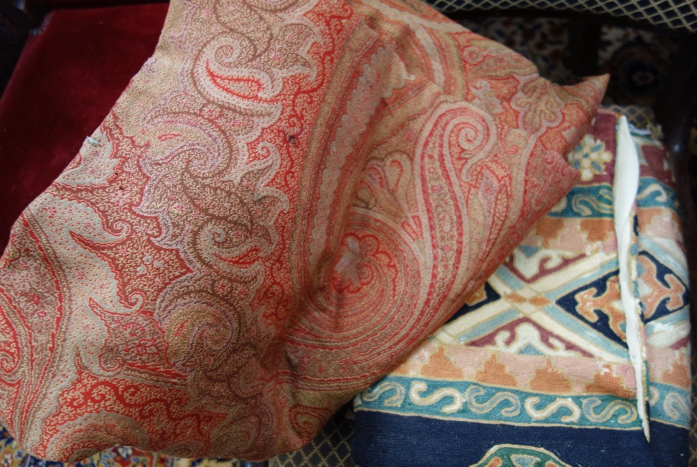 A PAISLEY SHAWL (examine) and two embroidered panels