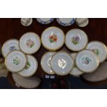 A VICTORIAN PART DESSERT SERVICE decorated with botanical specimens within gilt borders