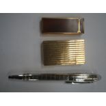 A DUNHILL LACQUERED LIGHTER, a gold plated Dupont lighter and a ballpoint pen (3)