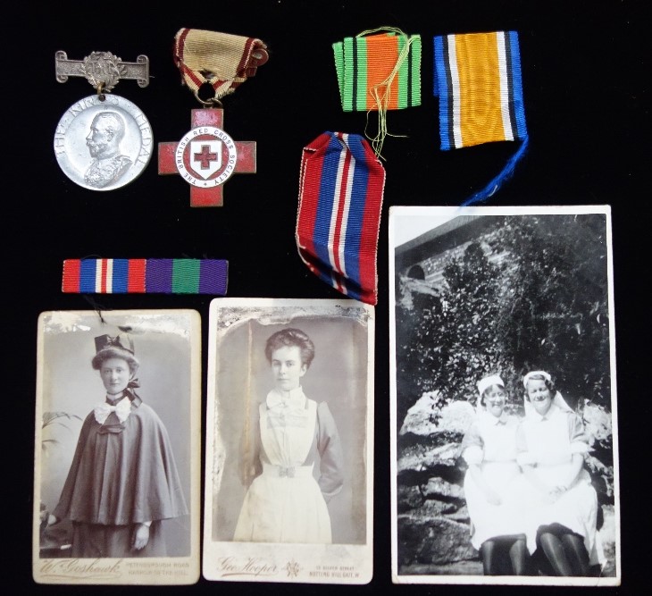 A VINTAGE RED CROSS ENAMEL BADGE, black and white photos of nurses and similar items