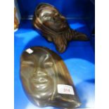 AN ART DECO WALL MASK of a woman and another similar