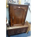 A GEORGE II OAK CORNER CUPBOARD and an oak coffer (2)