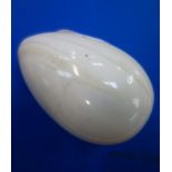 A 19TH CENTURY POLISHED IVORY EGG