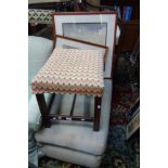 A GEORGE III MAHOGANY FOOT STOOL, a 1920s armchair and a similar foot stool (3)