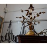A DECORATIVE METAL LAMP BASE formed as stems of roses, with a pair of rustic wrought iron three
