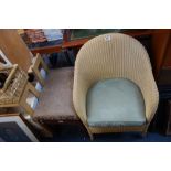 A WOVEN TUB CHAIR AND AN UPHOLSTERED STOOL