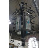 A GOTHIC STYLE CYLINDRICAL HALL LANTERN with wrought iron frame and cabochon detail, approx 55cm