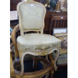 A GILTWOOD LOUIS XV STYLE FAUTEUIL FRAME, another similar in white and gilt and a matching white and