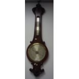 A VICTORIAN MAHOGANY CASED WHEEL BAROMETER by Negretti & Zambra with carved decoration