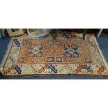 A SMALL AZTEC DESIGN RUG, 82cm x 136cm (plus fringes)