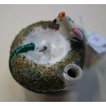 A 19TH CENTURY CERAMIC PEN STAND/INKWELL in the form of a nest, with a bird and a snake
