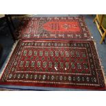 A RED GROUND PERSIAN DESIGN RUG and another similar (2)