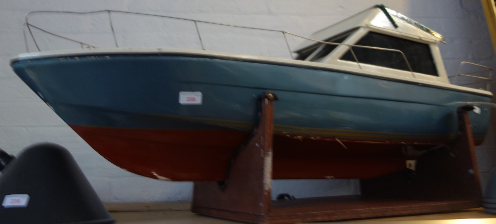 A SCRATCH BUILT MODEL CABIN CRUISER, with grey and red paint work, 112cm long