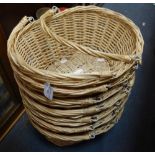 A COLLECTION OF TWO HANDLED HAND BASKETS