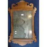 A GEORGE III MAHOGANY FRAMED WALL MIRROR with original plate