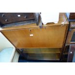 A MID 20TH CENTURY TEAK GLAZED BOOKCASE with fold-down writing desk above, 76cm wide