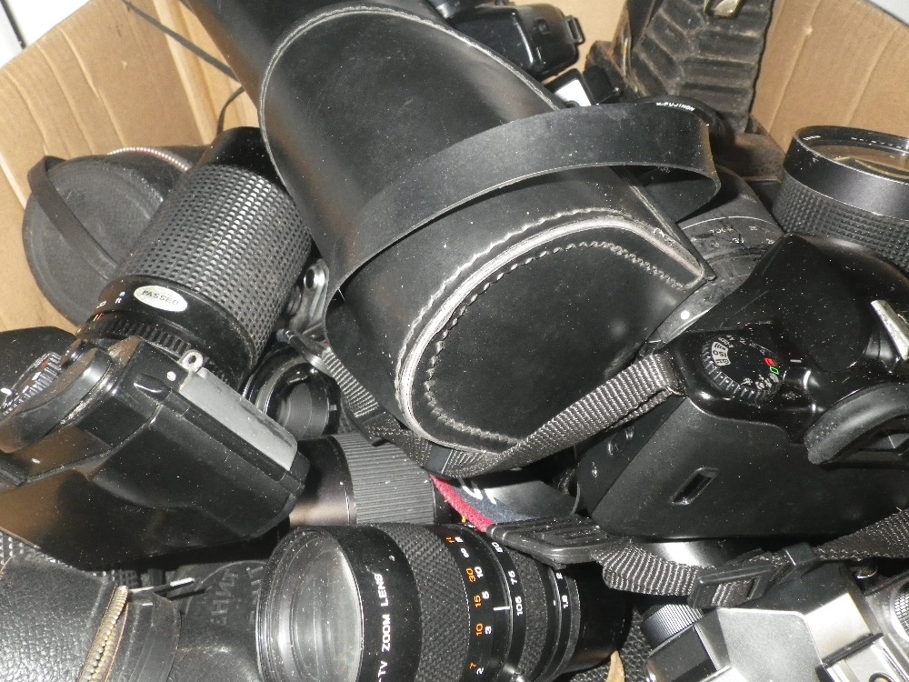 A COLLECTION OF CAMERAS, some older examples and lenses