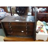 A VINTAGE WOODEN PORTABLE TOOL CHEST, fitted four drawers, a jewellery box and a spirit level