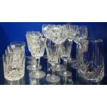 WATERFORD; A SET OF SIX CUT GLASS HOCK GLASSES, a water jug, four whisky tumblers, four wine glasses