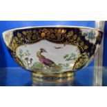 A SAMPSON STYLE PUNCH BOWL decorated with birds within a Royal blue and gilt background, 28cm dia.