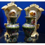 A PAIR OF 19TH CENTURY CONTINENTAL CERAMIC VASES hand painted with flowers and gilt decoration, 28.