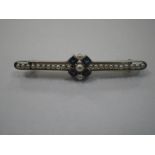 A SAPPHIRE AND SEED PEARL BAR BROOCH, the bar stamped "18ct PLAT"