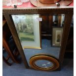 A CIRCULAR MIRROR, the frame with Middle Eastern script, 33cm dia. and an Edwardian wall mirror (2)