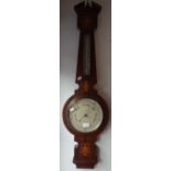 AN EDWARDIAN MAHOGANY CASED ANEROID BAROMETER AND THERMOMETER by Hurcomb & Co, London