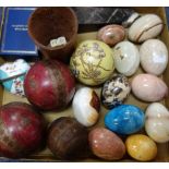 A COLLECTION OF MARBLE AND STONE EGGS, a similar obelisk. bone dice, a pair of decorative balls