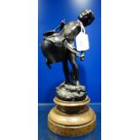 A 19TH CENTURY PATINATED BRONZE STUDY OF A CHILD CARRYING A VESSEL OF WATER, on a turned wooden